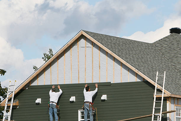 Professional Siding Contractor technician working in Carle Place, NY